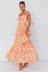 Vestido midi Arlowe con volantes y hombros anudados, estampado floral naranja