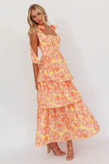 Vestido midi Arlowe con volantes y hombros anudados, estampado floral naranja