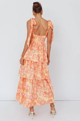 Vestido midi Arlowe con volantes y hombros anudados, estampado floral naranja