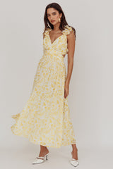 Vestido longo Madara com amarração nas costas e estampa floral amarela