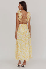 Vestido longo Madara com amarração nas costas e estampa floral amarela