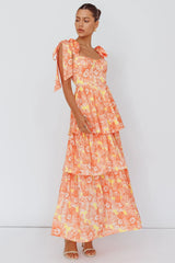 Vestido midi Arlowe con volantes y hombros anudados, estampado floral naranja